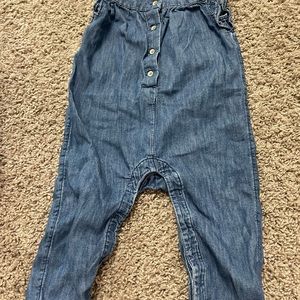 Sleeveless one piece long pants with ruffle and button front